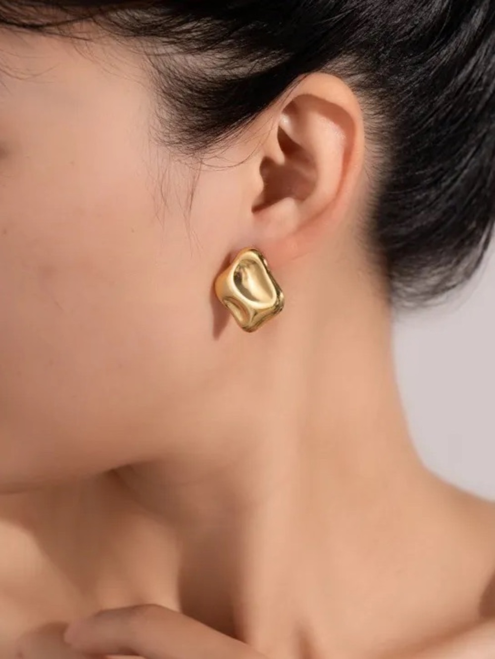 Gold Fluid Wave Stud Earrings.